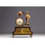 Rare "Astronomer Love" clock from the Empire period in gilded and patinated bronze.