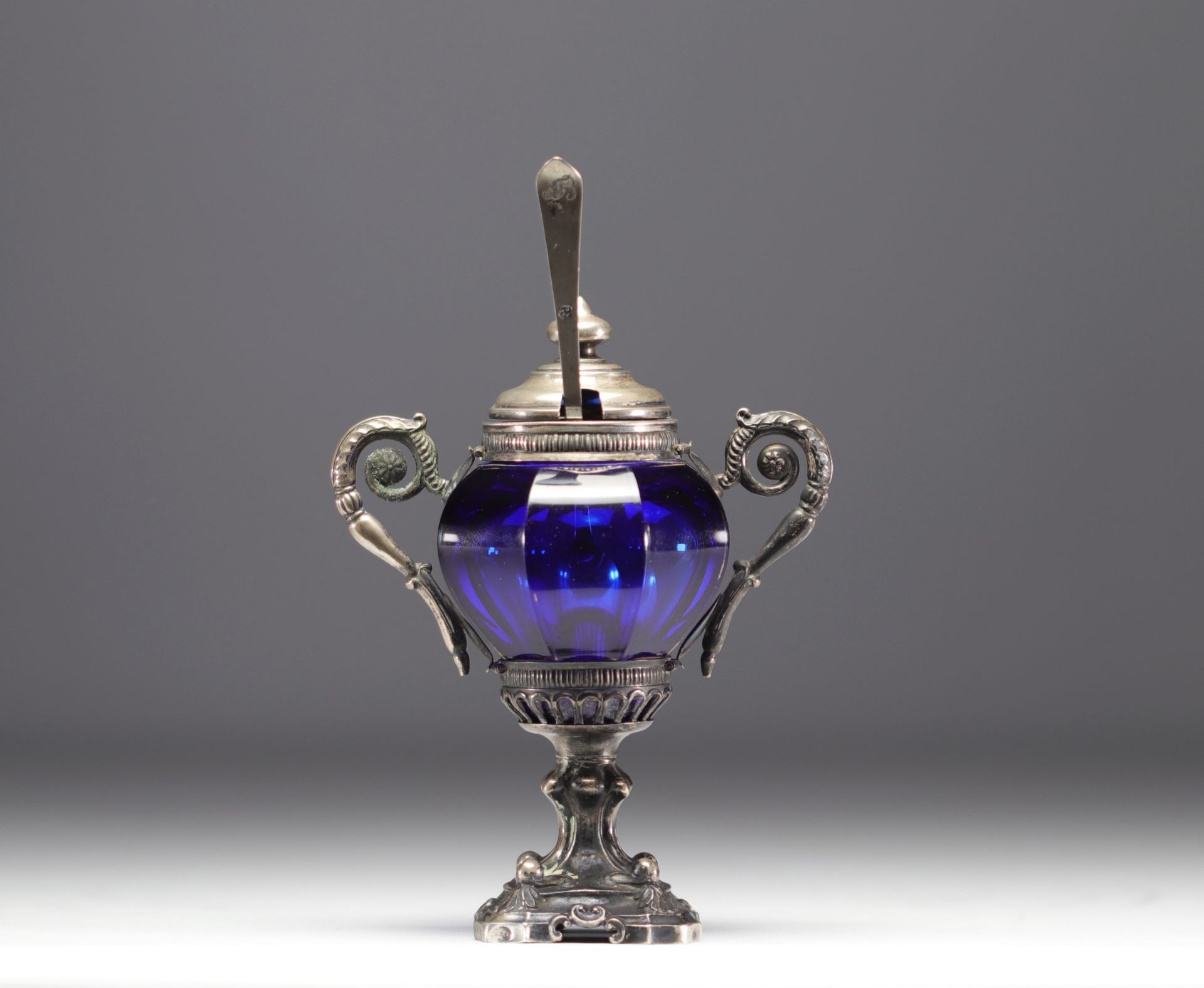 Solid silver mustard pot, blue glassware, hallmarks at the base of the frame.