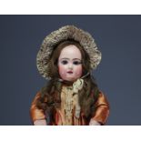 JUMEAU - Bisque head doll, size 11, closed mouth, fixed wrists, in original clothes.
