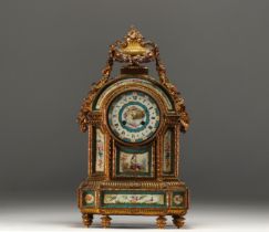 Chased bronze and Sevres porcelain mantel clock, 19th century.