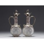 Pair of Baccarat crystal and silver wine decanters.