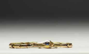 Articulated bracelet "Serpent" in 14k gold, cabochon sapphire and three diamonds, total weight 23g.