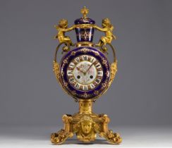A rare Sevres porcelain and gilt bronze clock decorated with cherubs.