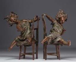 Pair of Babbitt metals "The little rascals" demontrating two little girls having fun on their chairs
