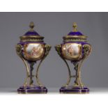 Pair of Sevres porcelain cassolettes decorated with gallant scenes, mounted on bronze.