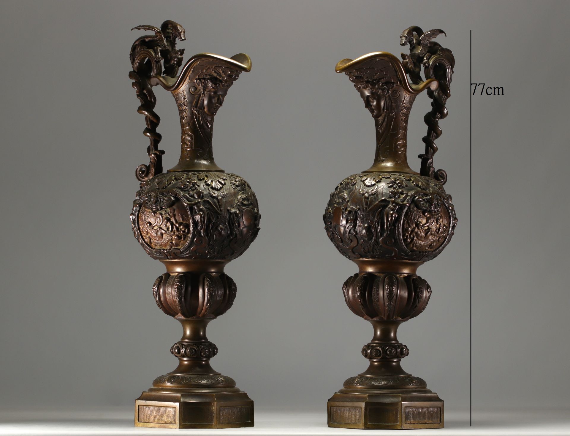 Large pair of ewers in bronze with double patina, 19th century.