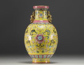 China - Famille rose porcelain vase on a yellow background, blue mark under the piece.