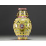 China - Famille rose porcelain vase on a yellow background, blue mark under the piece.