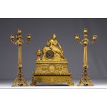 Gilt bronze clock and candelabra with Orientalist subjects, early 19th century.