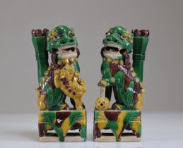 Pair of enamelled stoneware Fo dog incense holders, 18th century