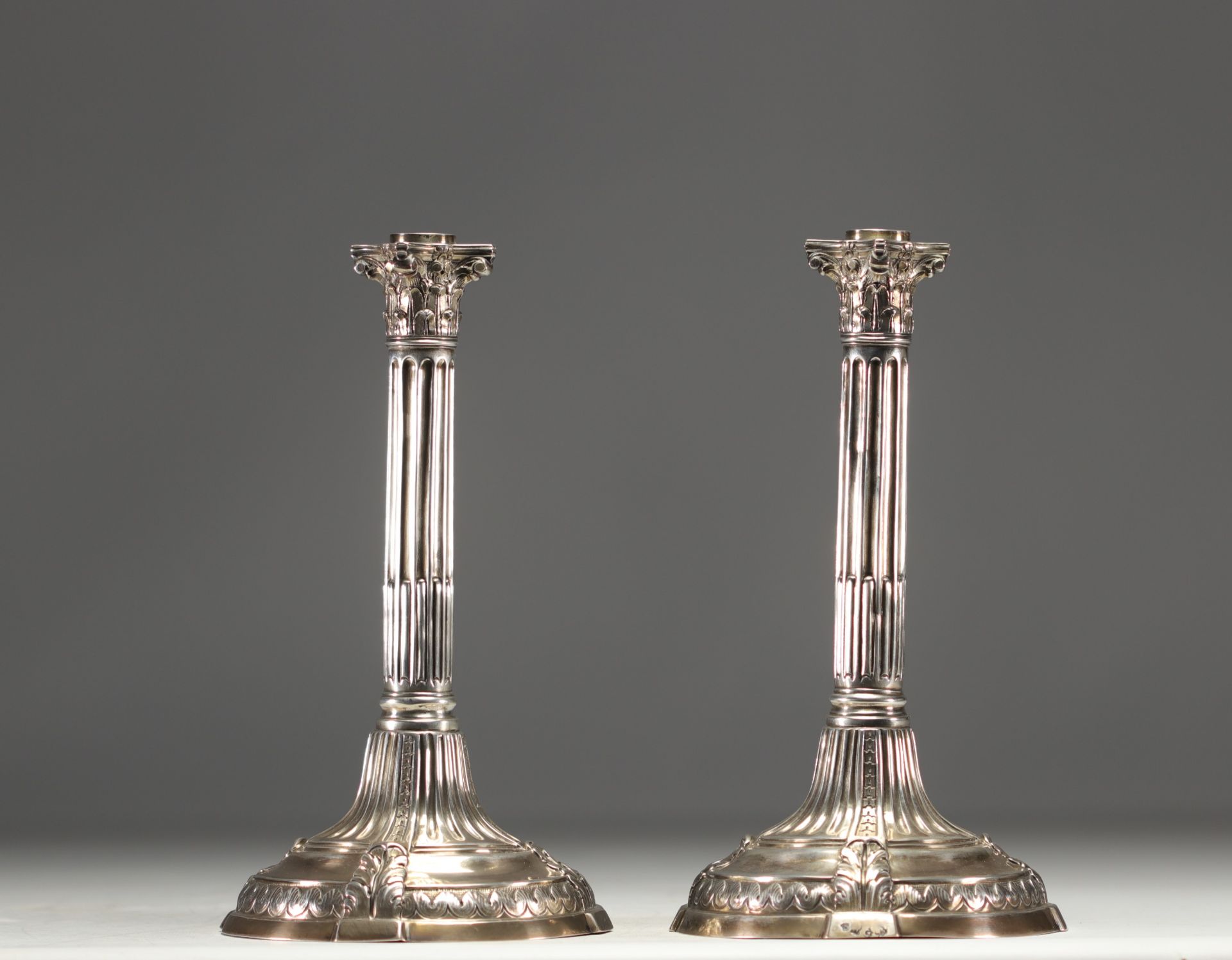 A pair of solid silver candlesticks with column decoration, hallmarked Tournai, Belgium, 18th centur
