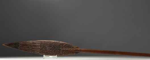 New Guinea, Sepik, Ceremonial paddle in carved wood with traces of polychromy.