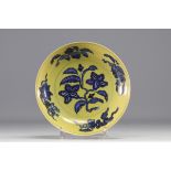 China - Porcelain dish decorated with flowers in white and blue on a yellow background, blue mark.