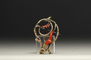 Brooch in various alloys of gold, silver and coral.