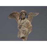 An ancient terracotta angel "fragment" representing Eros, a winged ephebe