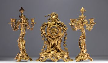 Louis XV style gilt bronze mantelpiece and candelabra, 19th century.