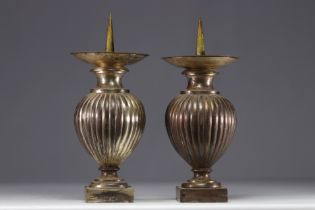 Pair of silver-plated brass candle-holders.