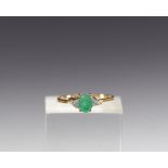Ring in 18k gold, oval-cut emerald and diamond, total weight 2.2gr
