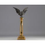 Watch and thermometer holder on marble column surmounted by an eagle in regula, late 19th century.