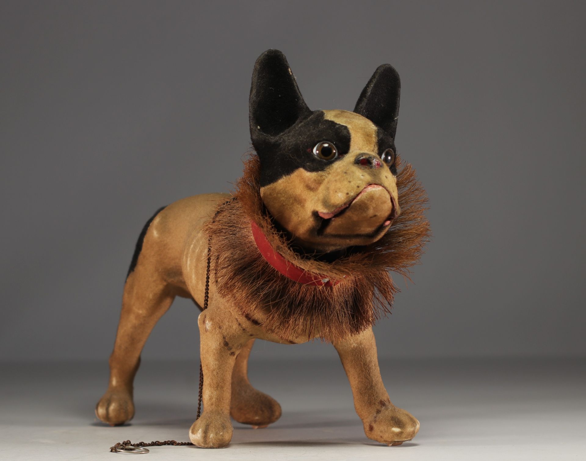 French bulldog toy in papier-mache on wheel, circa 1930.