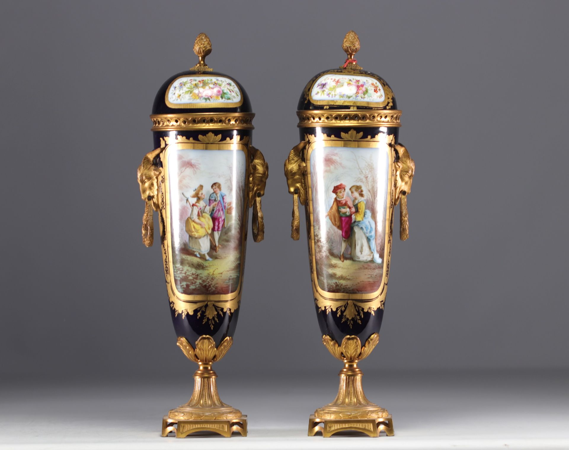 Sevres - Pair of bronze mounted porcelain covered cassolettes "Romantic scenes".