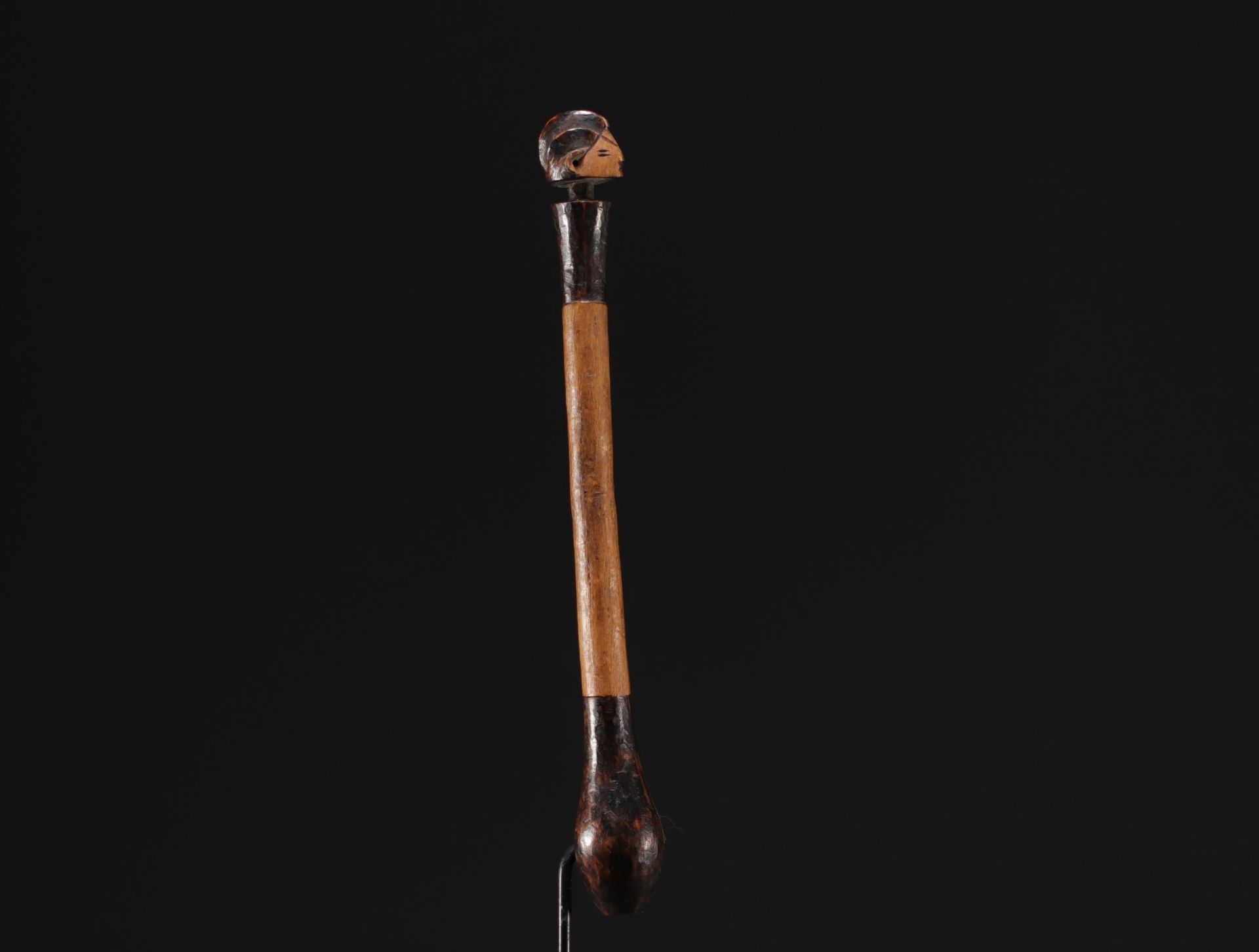 RDC - Adze handle surmounted by a carved head.