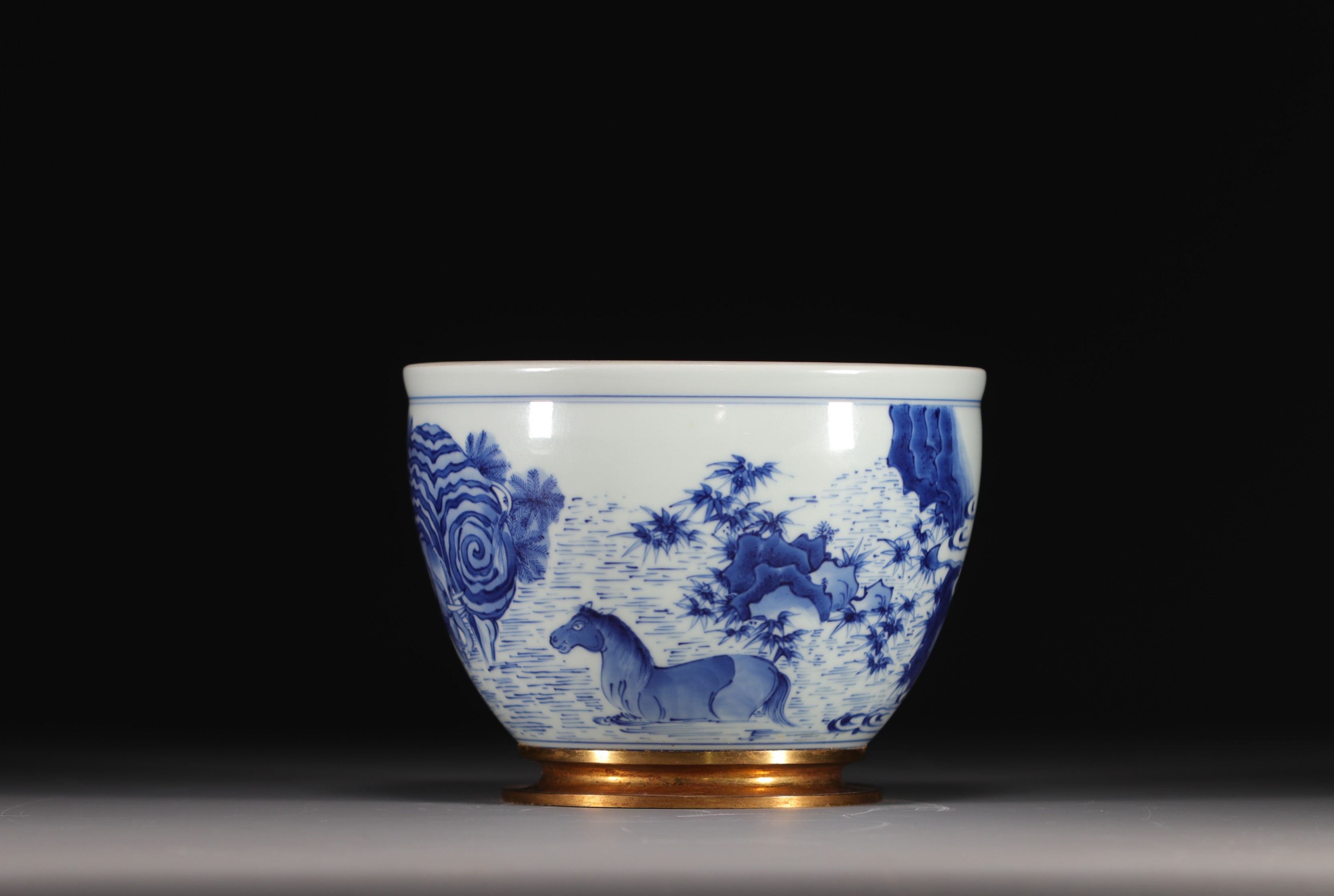 China - A white-blue porcelain vase decorated with elephant, horse and rabbit, Qing period.