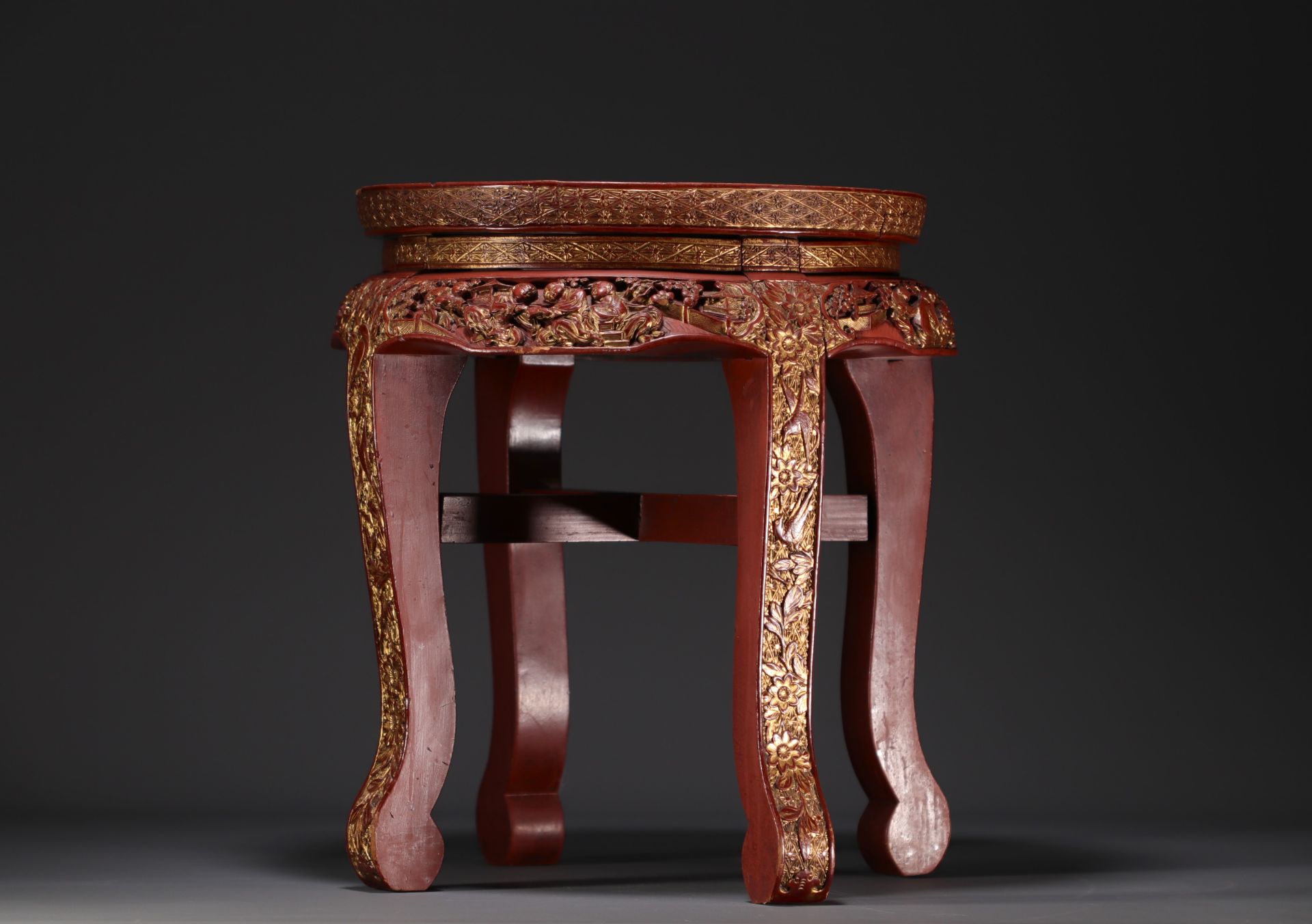 China - Small red and gold lacquer side table with carved figures and floral motifs, late 19th centu
