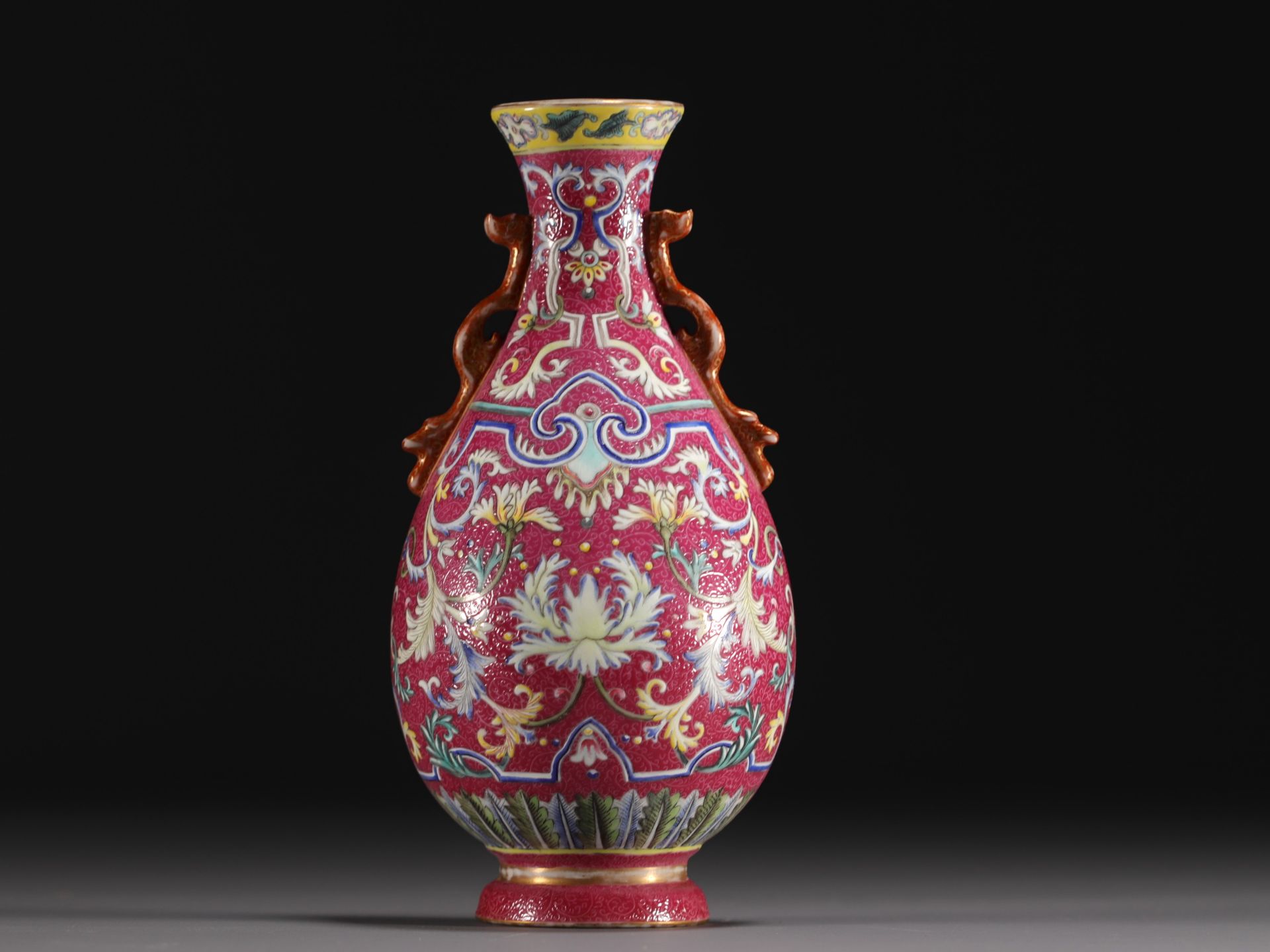 China - Famille rose porcelain wall vase on a ruby background, Qianlong mark.