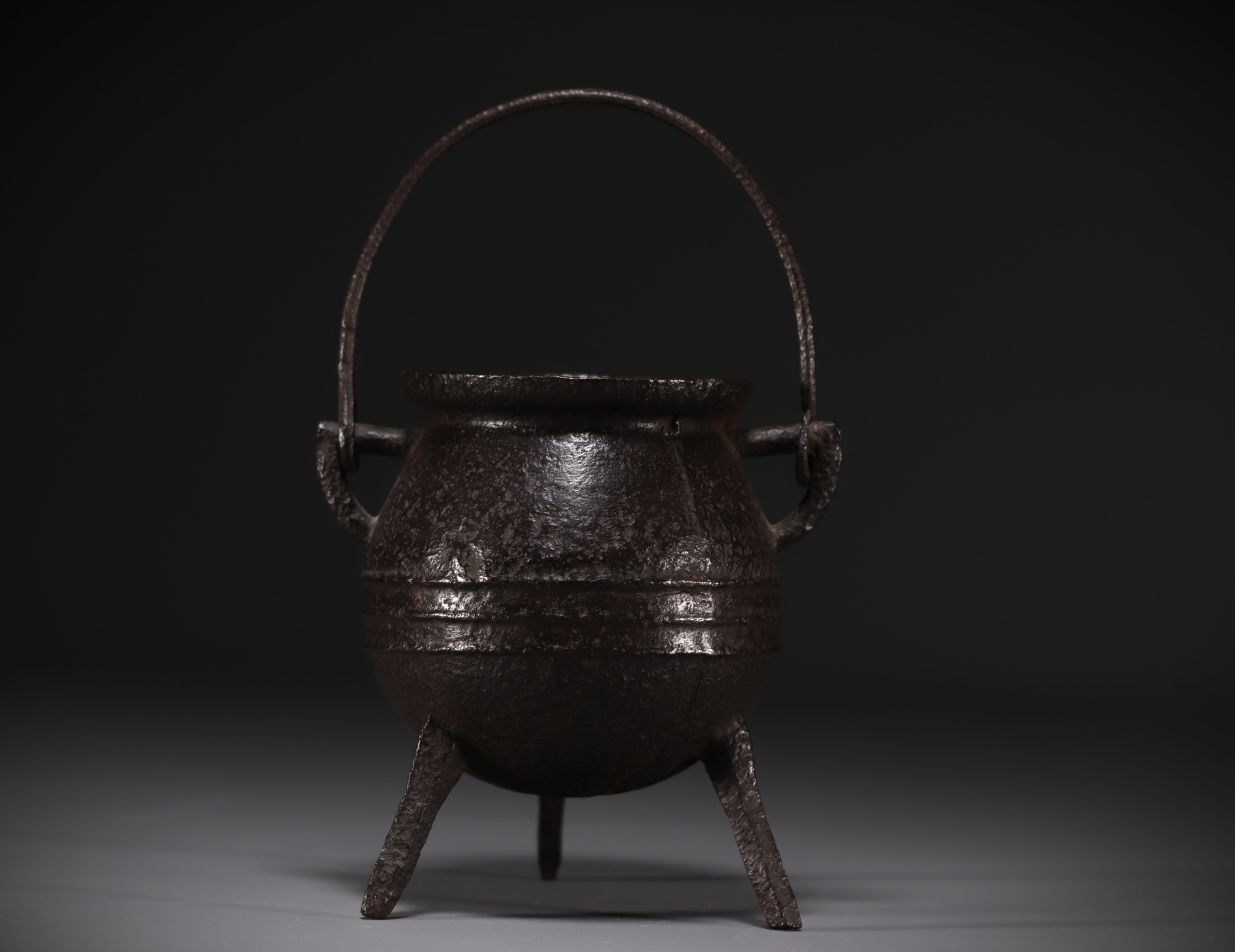 17th century cast iron tripod hearth cauldron.