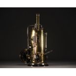 Vertical steam engine with whistle, circa 1900-1920.