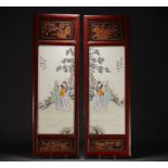 China - Pair of porcelain and wood panels decorated with characters.