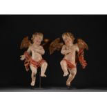 Pair of cherubs in polychrome carved wood, 18th century.