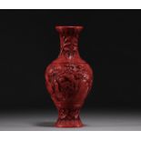 China - An antique cinnabar lacquer vase decorated with figures.