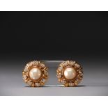 CHANEL - Pair of gold-tone earrings, rhinestones and mother-of-pearl cabochon.