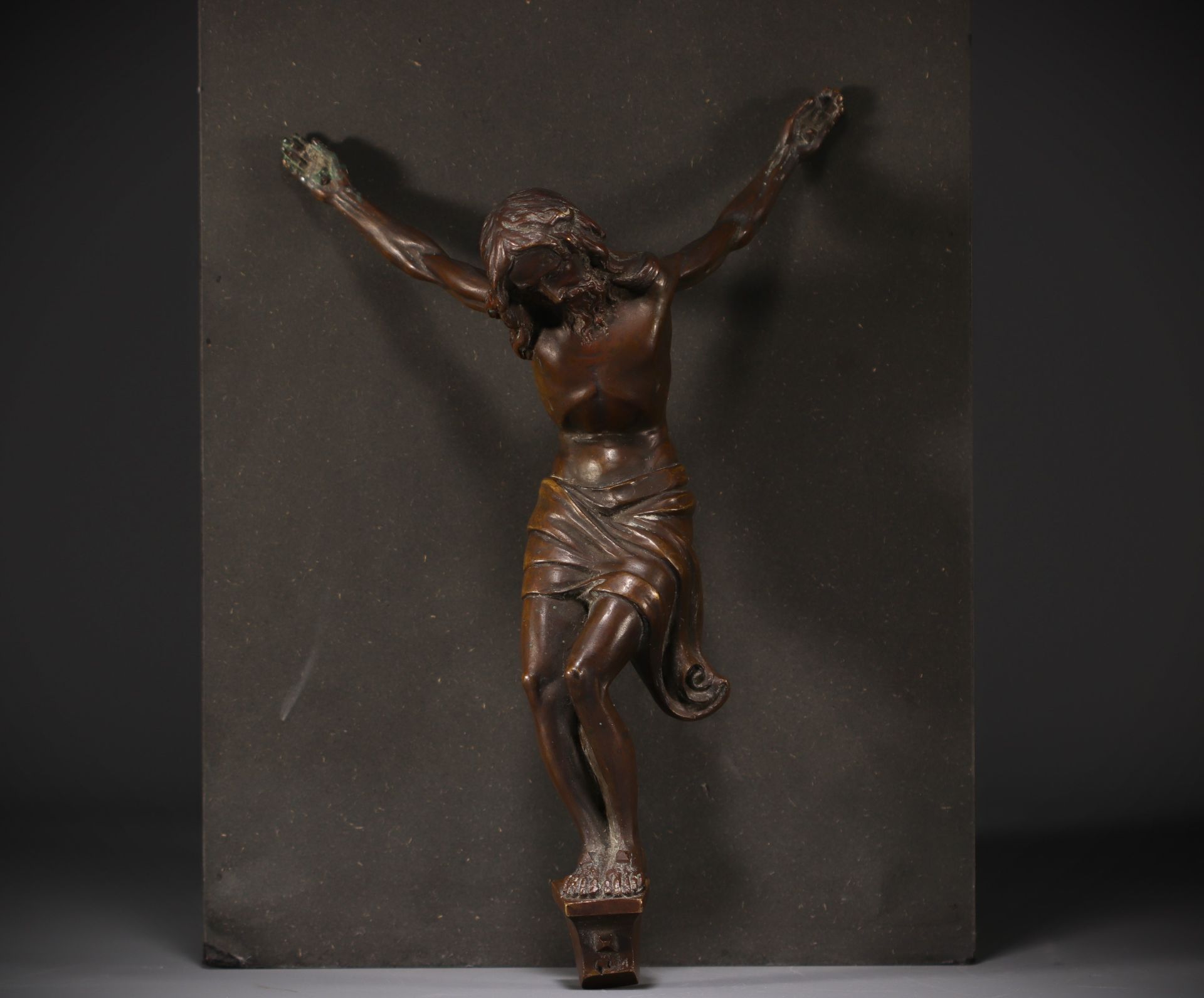 Christ in bronze with brown patina, twisted body, 18th century.