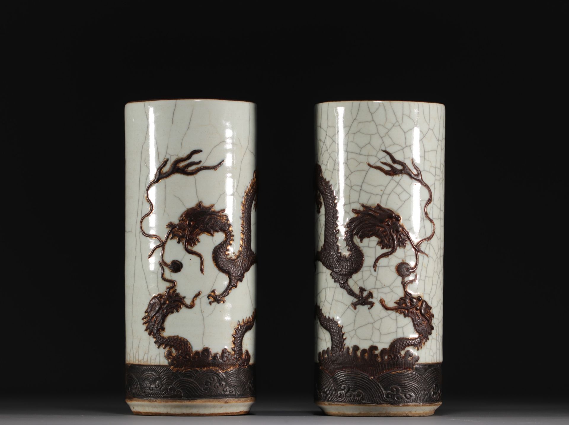 China - Pair of scroll vases decorated with dragons in relief, Qing dynasty.