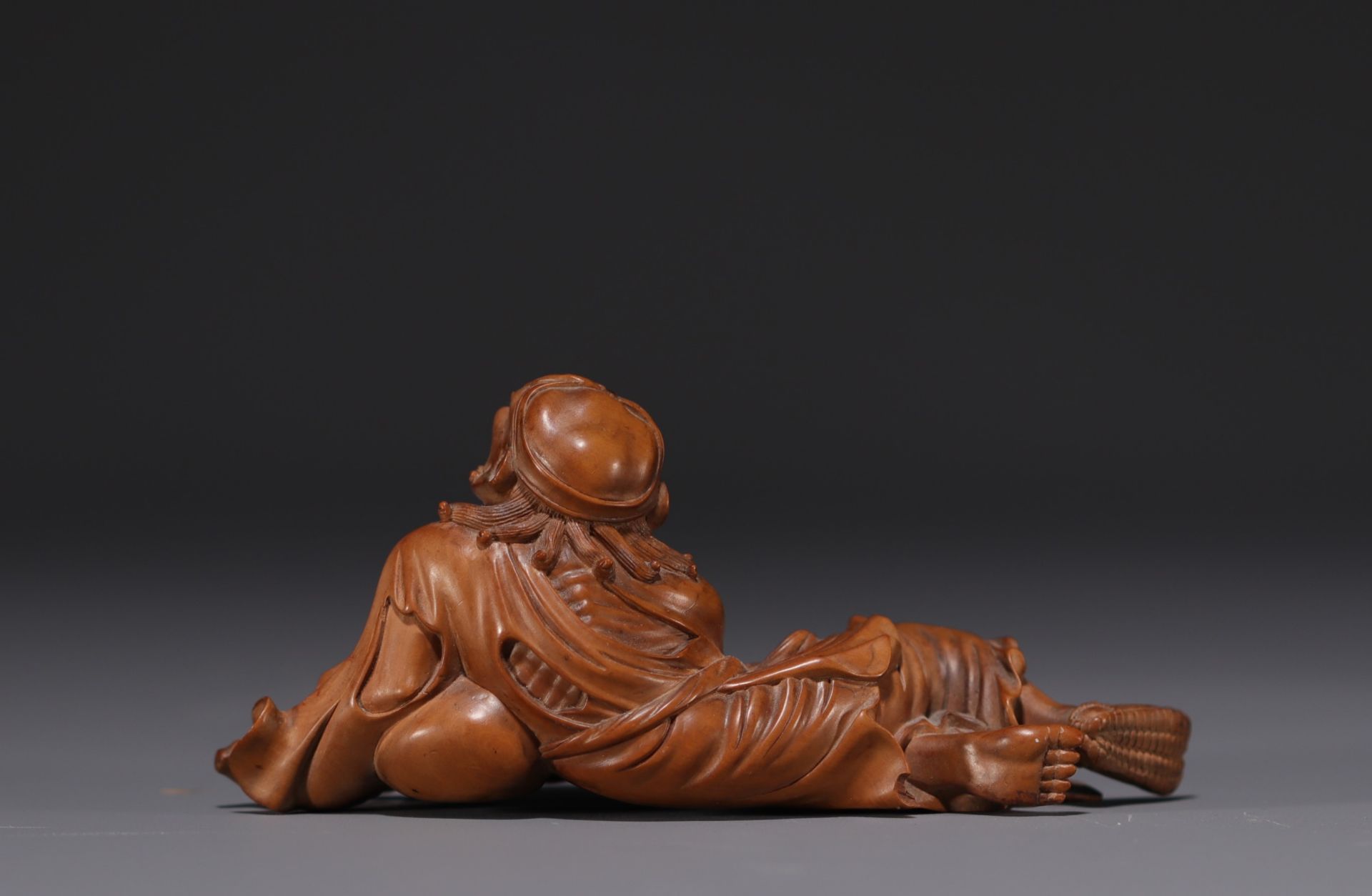 Japan - Boxwood sculpture of a reclining old man, late 19th century. - Image 2 of 3