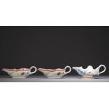 China - Set of three porcelain sauce boats, one blue white and two famille rose, 18th century.
