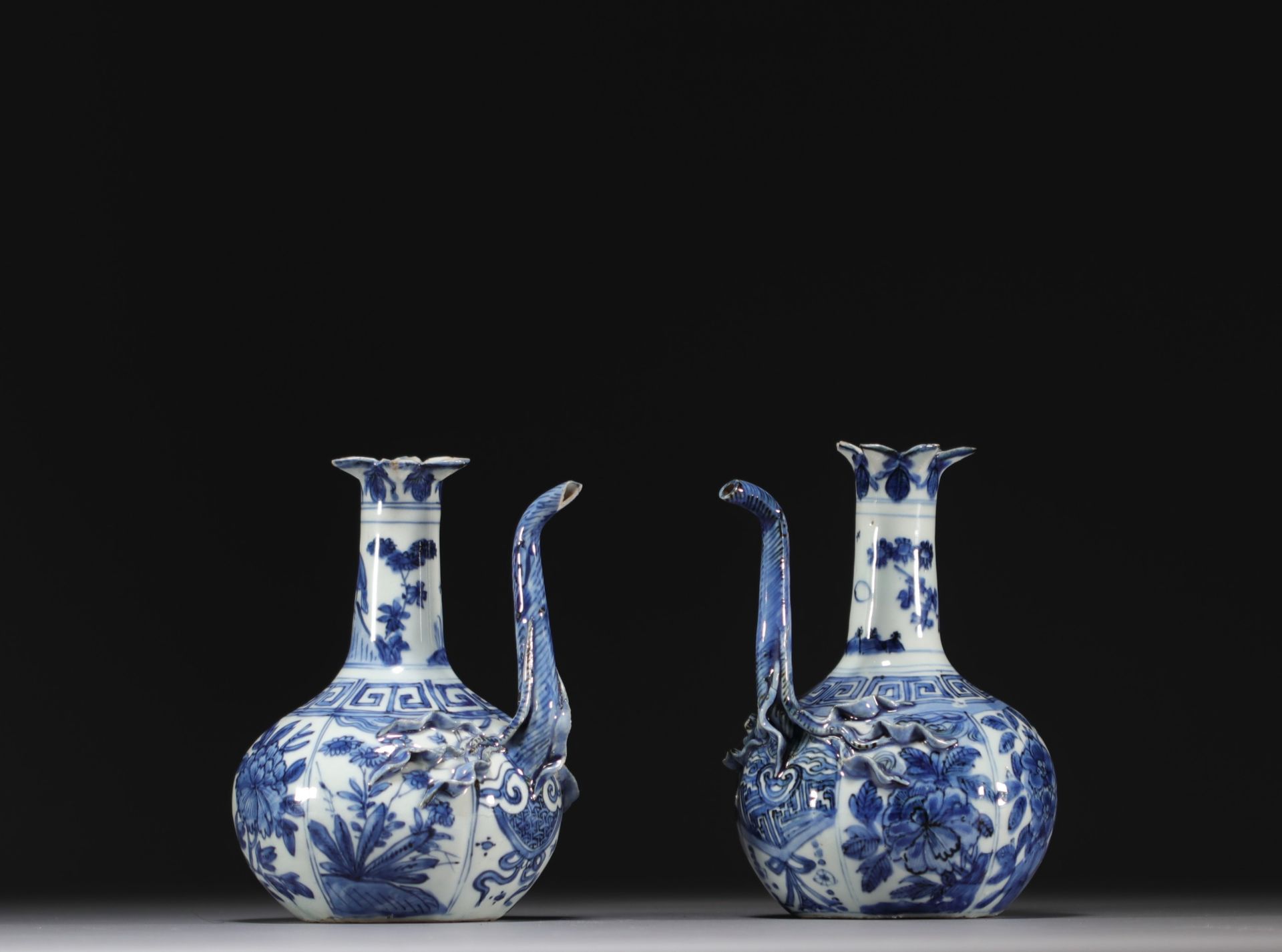 China - Pair of blue-white porcelain jugs with floral decoration, Wanli, Ming dynasty.