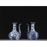 China - Pair of blue-white porcelain jugs with floral decoration, Wanli, Ming dynasty.