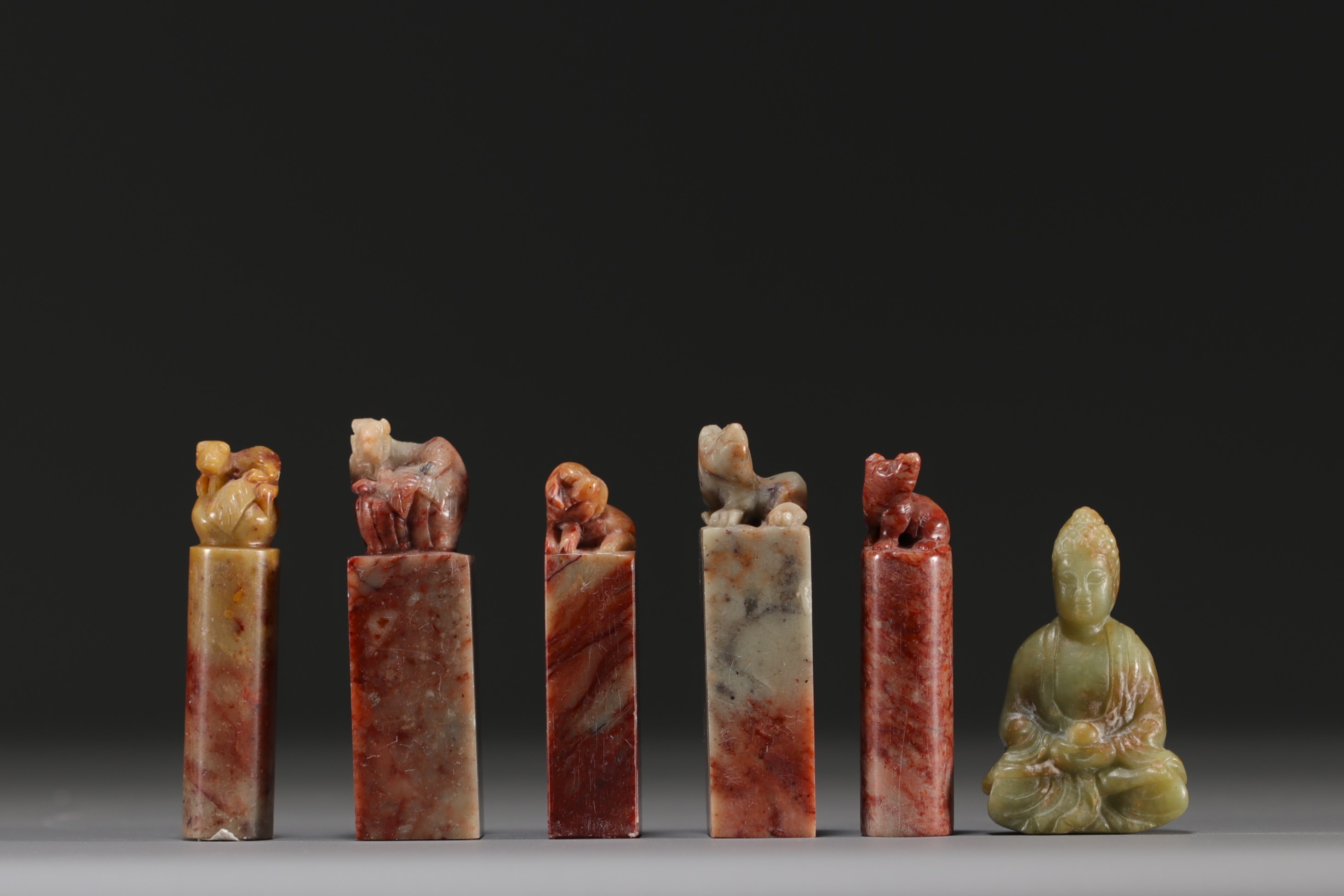 China - Set of five hard stone seals and a carved jade figure.