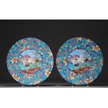 Longwy - Pair of large enameled plates decorated with cranes.