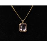 18k yellow gold pendant, octagonal-cut sapphire, total weight 28g.