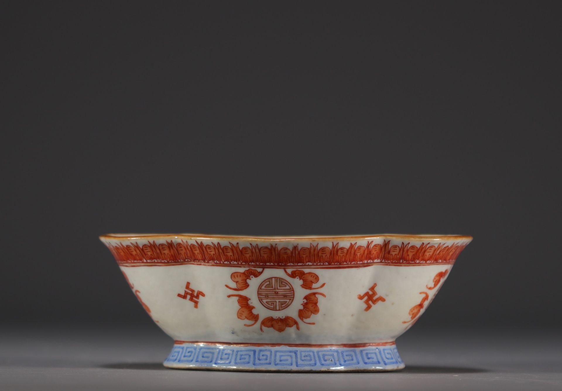 China - Polylobed porcelain bowl on a foot with bat decoration.