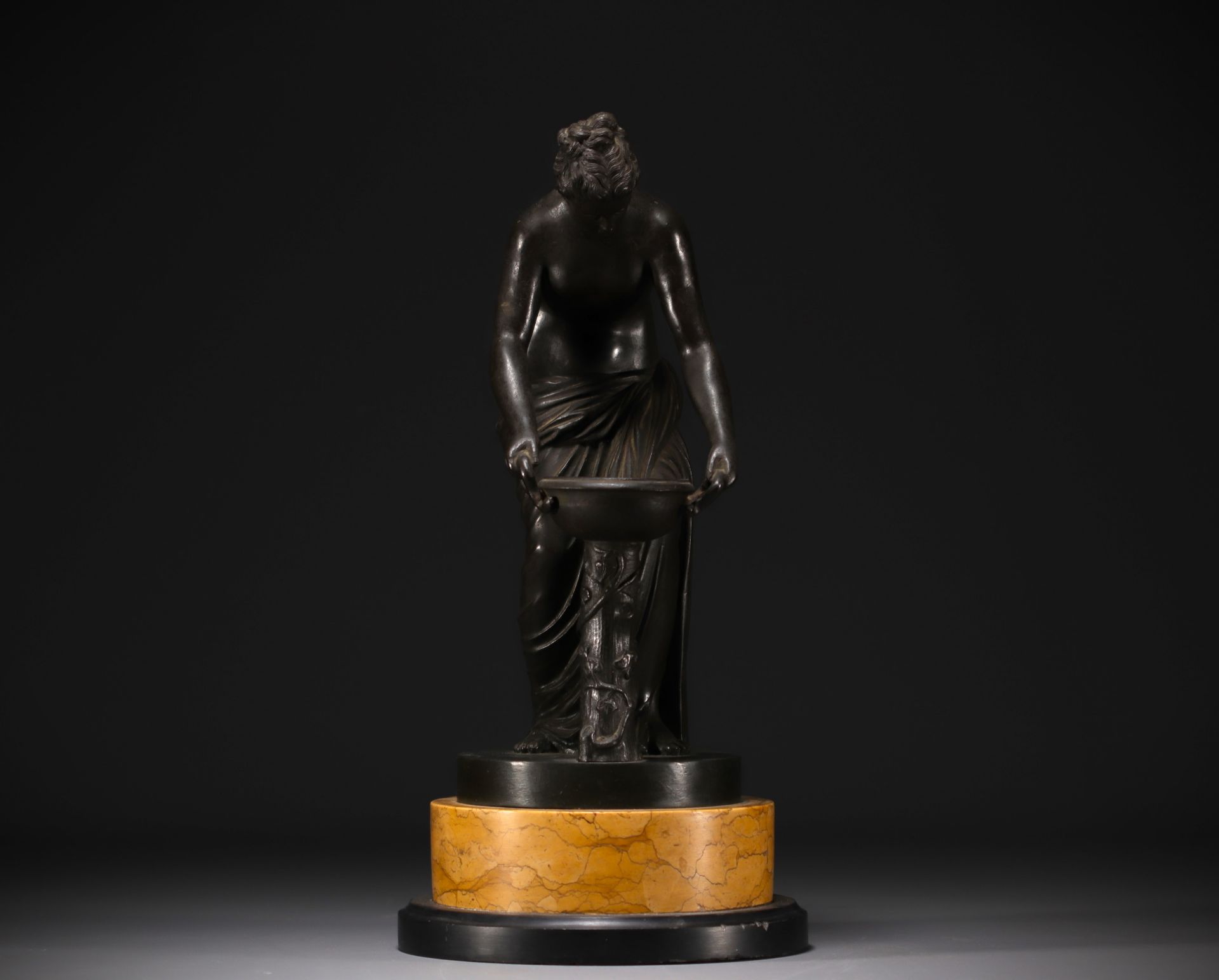 "Venus" Antique bronze with green patina on a two-tone marble base, late 19th century.