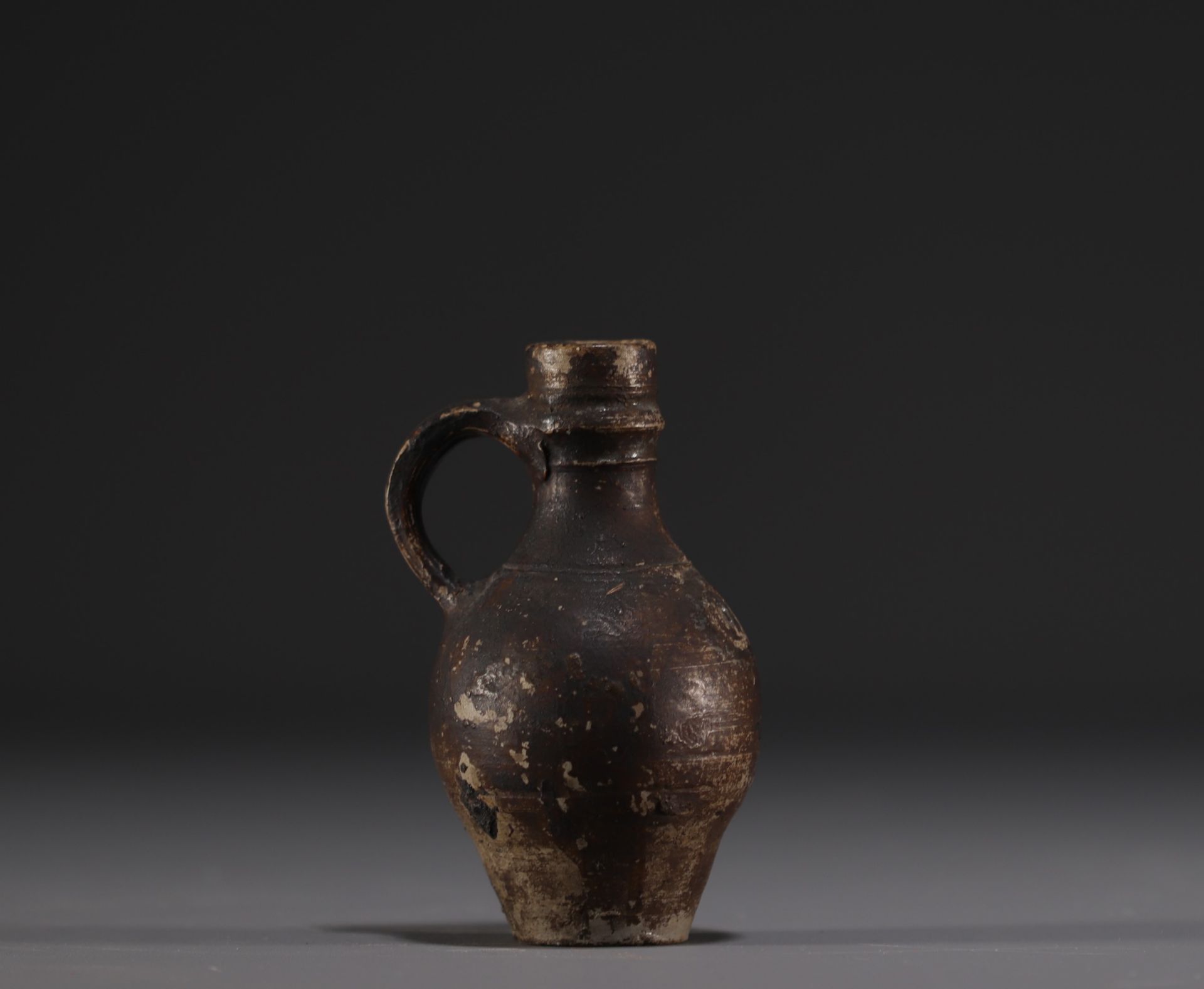 Raeren - Stoneware miniature jug with face decoration, 16th century. - Image 2 of 5