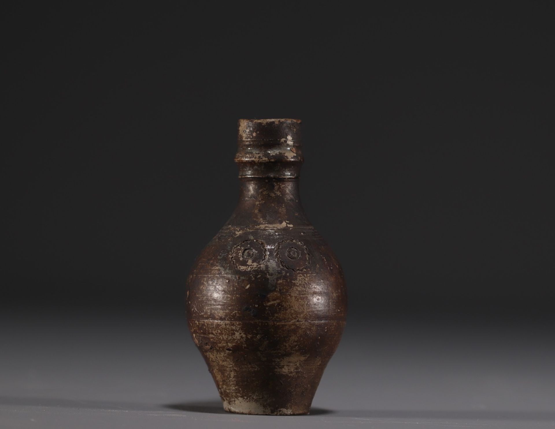 Raeren - Stoneware miniature jug with face decoration, 16th century.