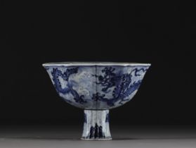 China - Bowl on foot in blue-white porcelain decorated with dragons in waves, Xuande mark.