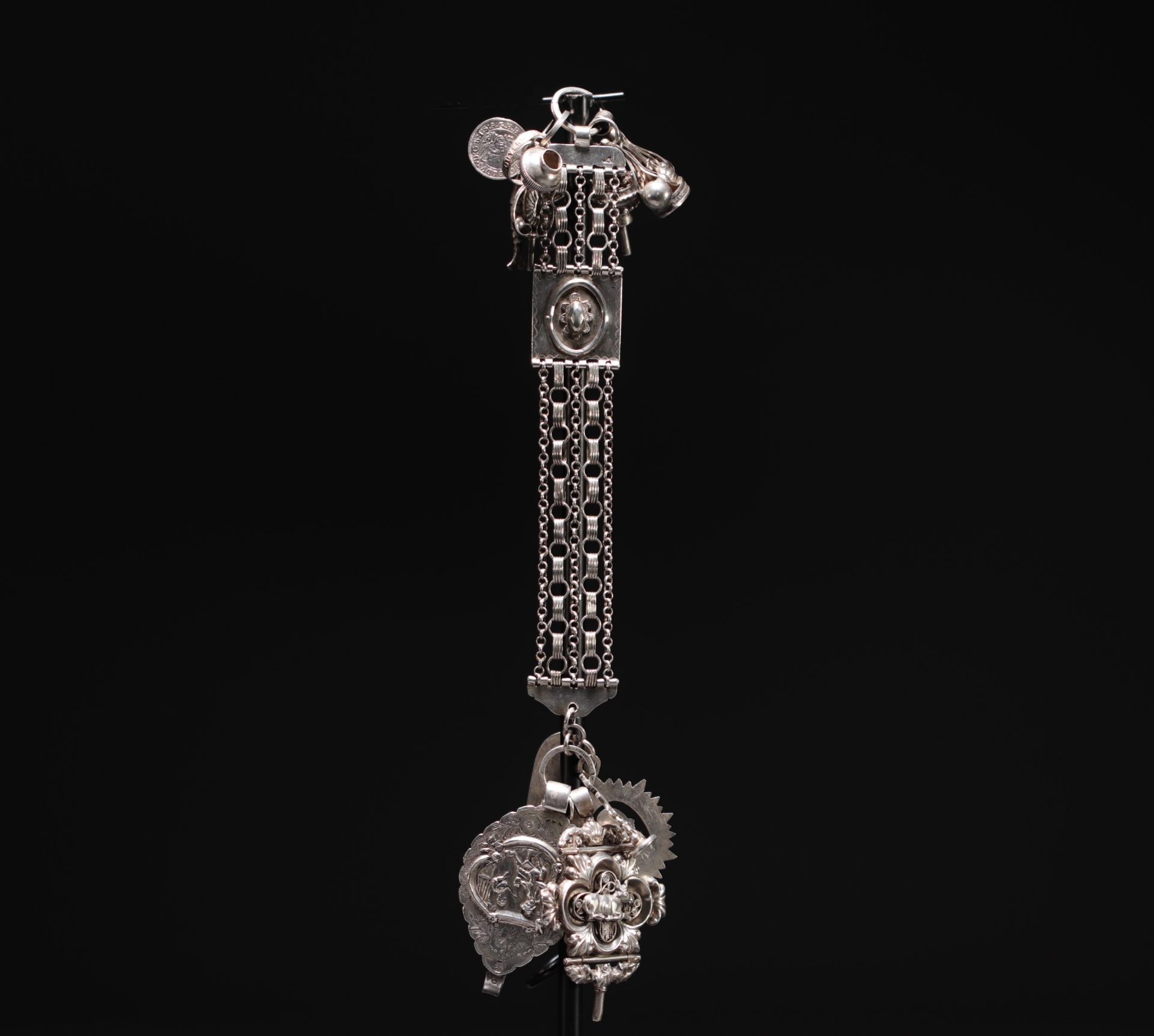 Magnificent large silver chatelaine decorated with various charms, Dutch hallmarks and others.